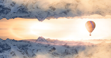 Magical Fantasy Aerial Landscape with a mirrored Mountain World. Hot Air Balloon Flying. Adventure Composite. Nature Background Image from British Columbia, Canada. Sunset Sky