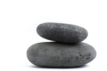 Two large shaped stones on a white background.