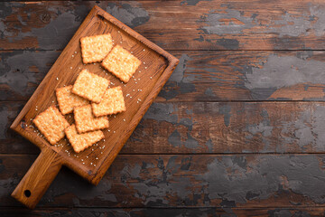 Obraz na płótnie Canvas Sesame cracker, cracker, cookie cracker on different backgrounds