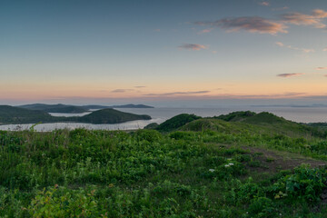 Obraz premium Landscape with sea and green hills