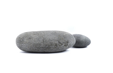 Fototapeta na wymiar Two large shaped stones on a white background.