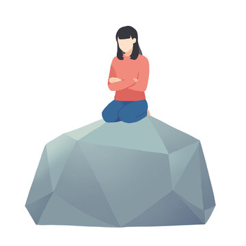 石の上に座っている女性