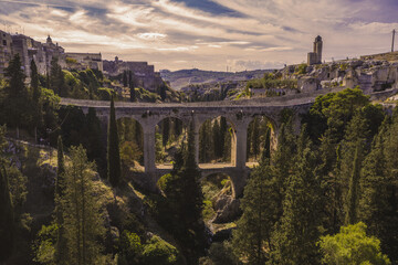 Aerial view of the ancient Bridge of Gravina in Puglia with the canyon, 007 No time to die