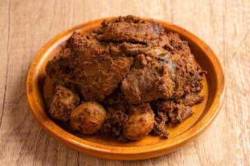 Beef Rendang is a Minang dish originating from the Minangkabau region in West Sumatra, Indonesia.  Rendang has been slow cooked and braised in a coconut milk seasoned with a herb and spice mixture