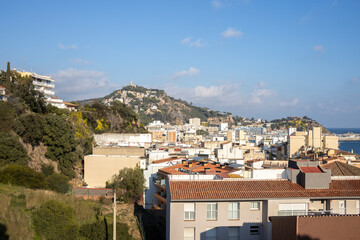 Landscape of mediterranean tourist city. View of the sea and the city on a sunny day.