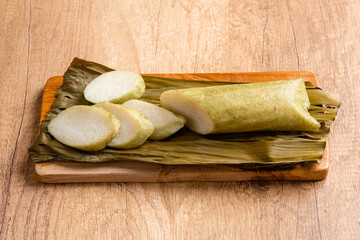 Lontong is an Indonesian dish. Rice is rolled inside a banana leaf and boiled, then cut into small cakes as a staple food replacement of steamed rice.