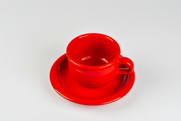 Ceramic red coffee mug close up. Coffee isolated on a white background. Copy space and free space for text near the drink.