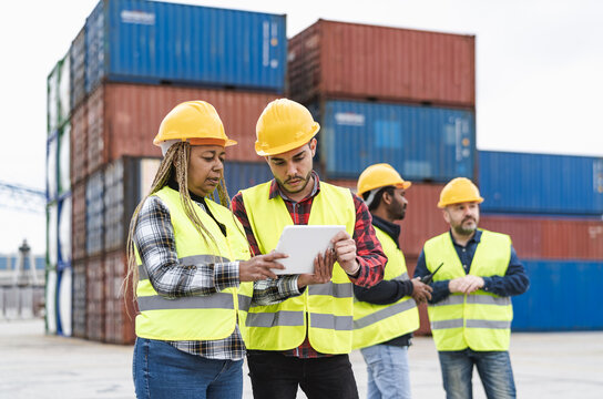 Industrial engineers working in logistic terminal of container cargo