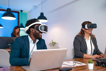 Business people wearing virtual reality glasses while working in modern creative space