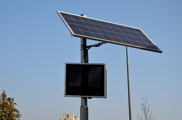 radar to measure the speed of vehicles in the city. A reflective green sign on a pole with LED...