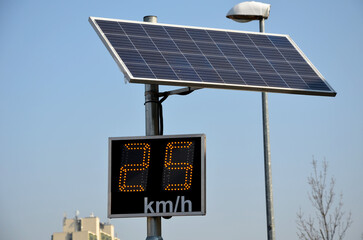 radar to measure the speed of vehicles in the city. A reflective green sign on a pole with LED light numbers informs car drivers how fast they are going. speeding is punishable by a fine a revocation