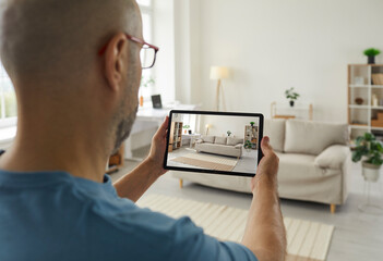 House seller giving a virtual video tour around his recently renovated home. Adult man who plans on...