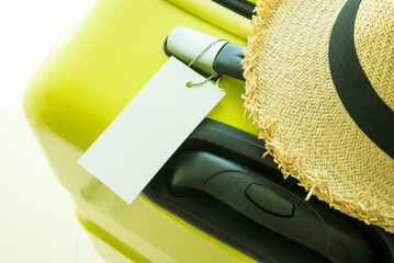 Blank tag label luggage, travel bag suitcase with straw hat on top - Travel holiday and travel...