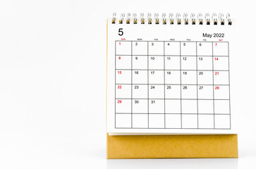 May 2022 desk calendar on white background.