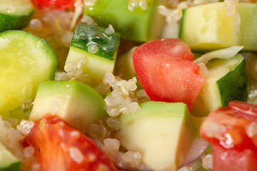 Salad of fresh vegetables and herbs with quinoa seeds and olive oil