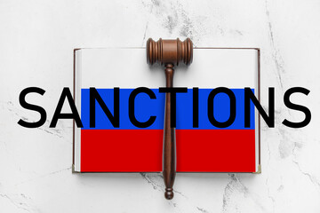 Judge's gavel and open book on light background