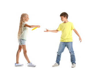 Funny little children playing frisbee on white background