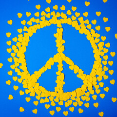 Yellow hearts forming the peace sign. Papercut concept with ukraininan colors - yellow and blue