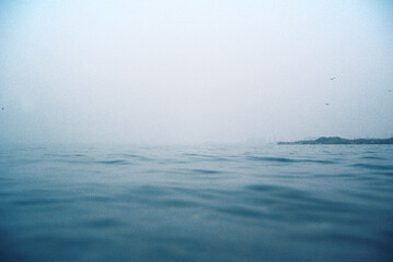 Misty foggy day over a blue sea