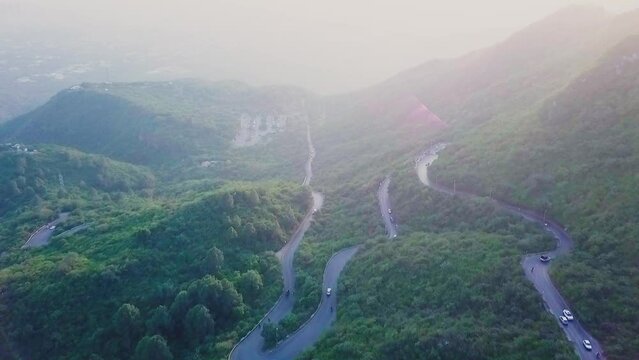 Aerial Flying Over Winding Roads Near Daman E Koh In Margalla Hills, Islamabad