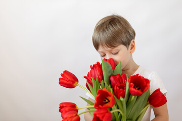 Little child with red tulips