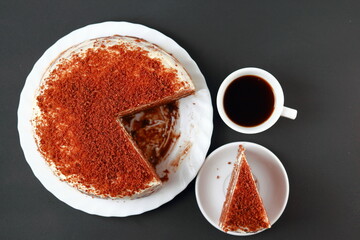 A cup of coffee with cake