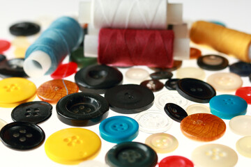 Multicolored threads and buttons for clothes.