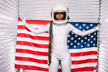 Black astronaut with American flag