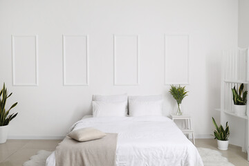 Fototapeta na wymiar Interior of modern bedroom with beautiful houseplants