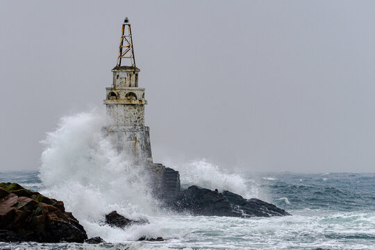 Big storm near an old lighthouse in Achtopol bay, Black sea, Bulgaria