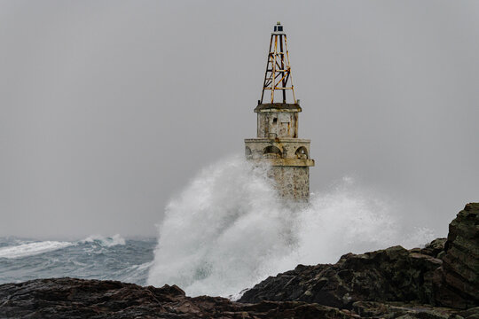 Big storm near an old lighthouse in Achtopol bay, Black sea, Bulgaria