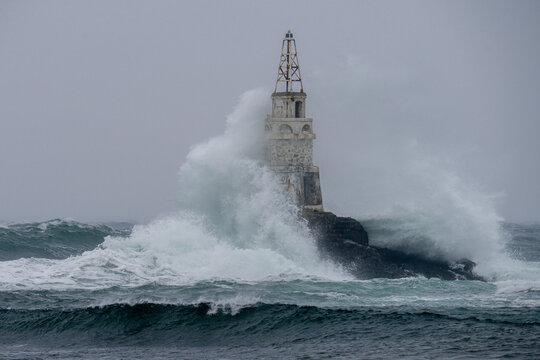 Big storm near an old lighthouse in Achtopol bay, Black sea, Bulgaria