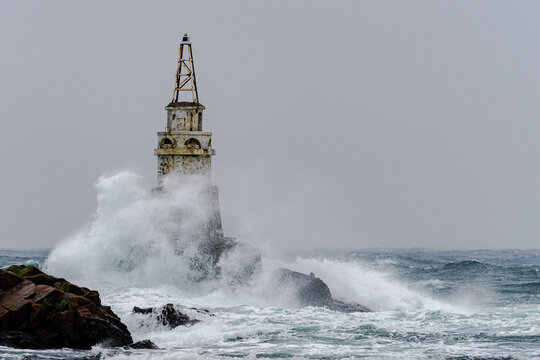 Big storm near an old lighthouse in Achtopol bay, Black sea, Bulgaria
