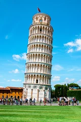 Wall murals Leaning tower of Pisa Picturesque landscape with church and famous sloping tower in Pisa, Italy. fascinating exotic amazing places.