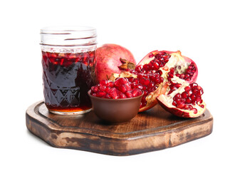 Jar of pomegranate molasses and fresh fruits on white background