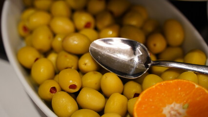Green Pepper Olives in the Plate Close Up