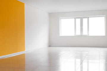 View of big empty room with window, yellow and white walls
