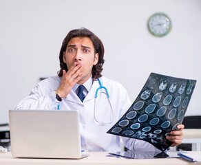 Young male doctor radiologist working in the clinic