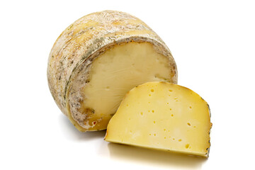 Goat cheddar cheese isolated on a white background. close up