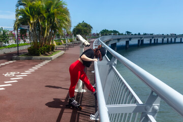 young person stretching on the bridge
