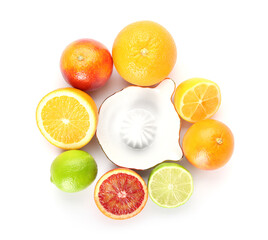 Fototapeta na wymiar Ceramic juicer and citrus fruits on white background