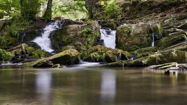 Beautiful view of a waterfall in a forest in Harz, Germany