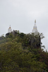 A temple's pagoda in northern Thailand, erected on top of a steep mountain.
