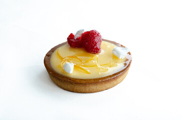 Closeup of a Lemon tart with strawberry on a white background