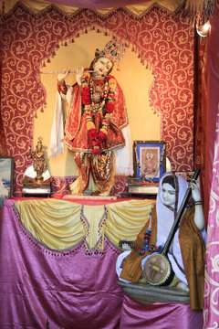 Vertical shot of Santa Meera singing bhajans in Meera temple near Vijay Sthambh, Rajasthan, India