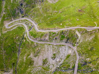 Winding road aerial view by drone. Sibiu, Romania. A great place to drive and stop during a road trip.