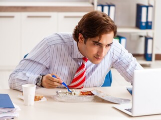 Man having meal at work during break