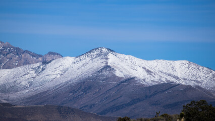 Fototapeta na wymiar Mountain with winter snow on top