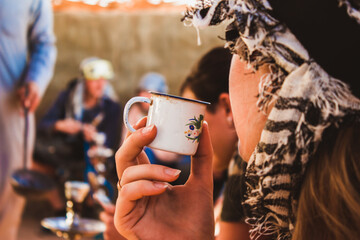 Closeup shot of a woman drinking bedouin tea in Egypt