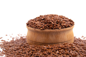 Healthy brown linseeds in bowl isolated on white background. Close up